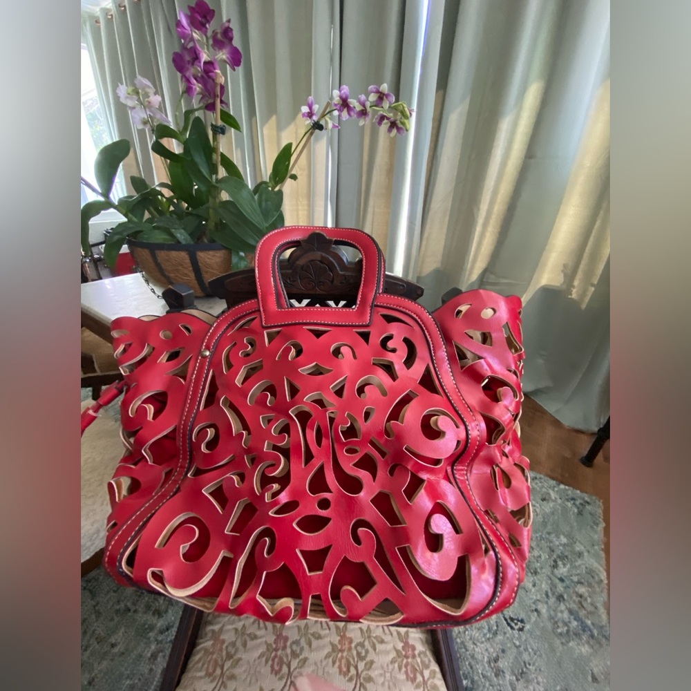 Red leather purse with cut outs